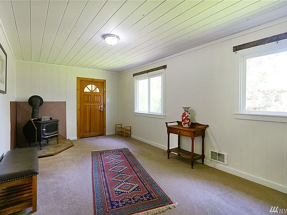 Living room with the woodstove for cozy winter evenings.