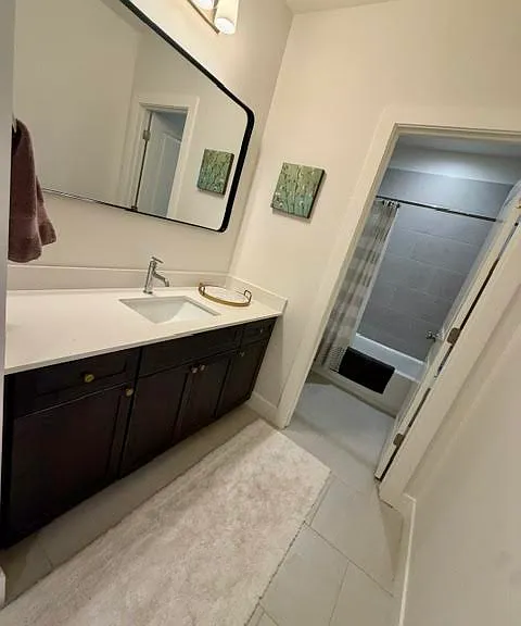 Bathroom with separate area for the toilet and shower.