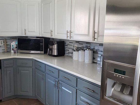 Beautiful updated kitchen with quartz counter tops. Dishwasher.