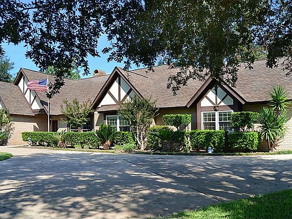 This view captures the synergy from the set of 4-gable roofs that intersect the horizontal plan of the home.   Massive pecan trees and mature landscaping provide the ideal complement...