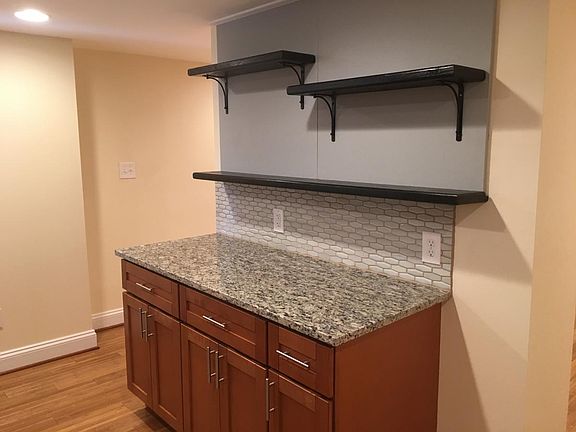 Kitchen - open shelving, granite counters