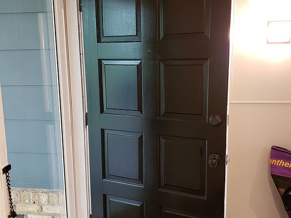 Black solid wood front door.
