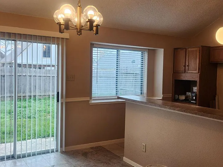 Kitchen area overlooking patio backyard.