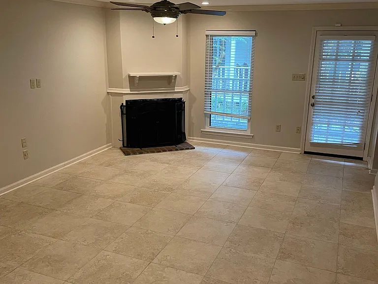 open floor plan in living room with front porch access