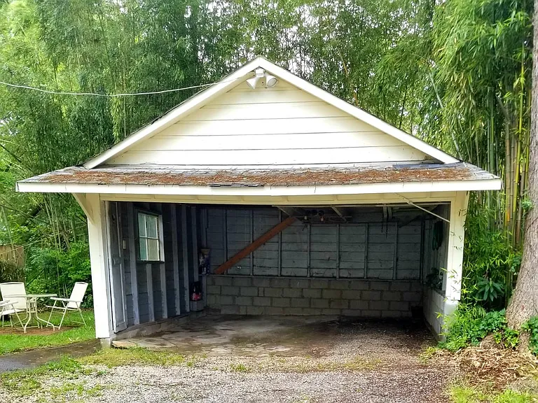 Garage behind home for covered off-street parking and storage.