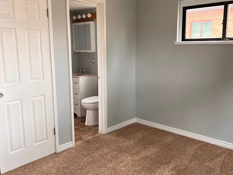 back bedroom with shared bathroom in between
