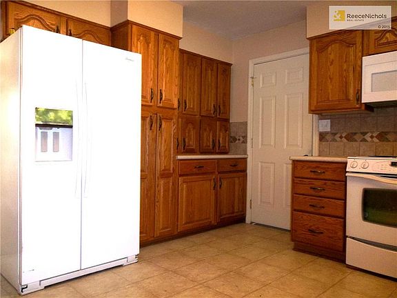 Newer Refrigerator and one of two Pantries.