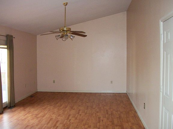 family room with vaulted ceilings