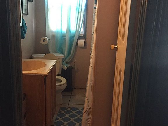 A peek into the bathroom from the hallway