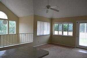 Living room and view of balcony/deck