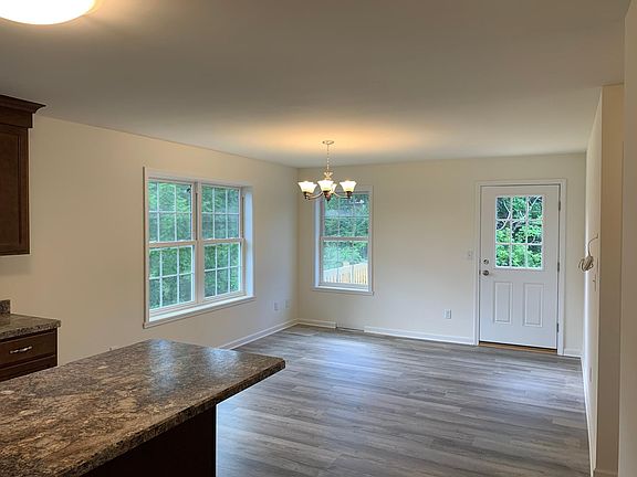 eating area with a door that leads to a deck.