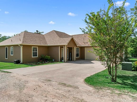 Easy access from the road through a gated driveway leads you to the front of the home. Updated landscaping and a very well kept home await you. The garage is 22 feet deep and fits a large truck and suv.