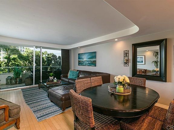 Living room and dining room looking into the balcony