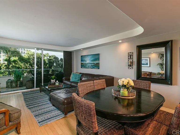 Living room and dining room looking into the balcony