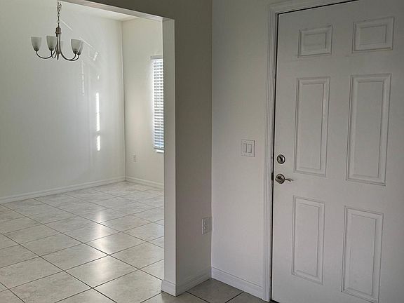 Entrance and Den/Media/Dining Room