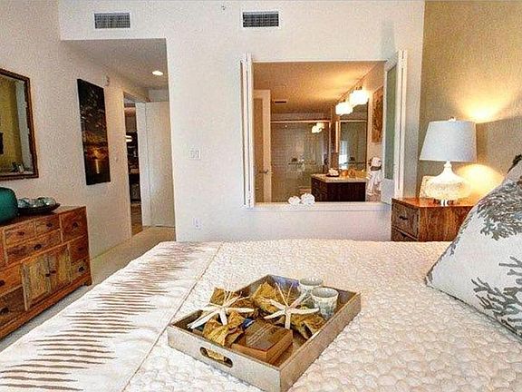 Master Bedroom with peekaboo shutters to bath