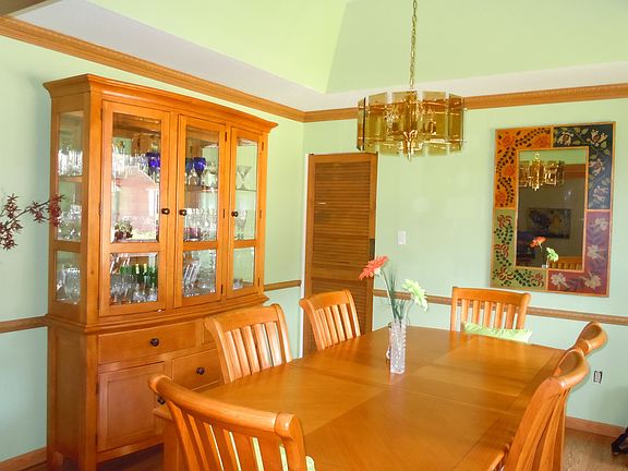 another view of dining room with saloon door to kitchen