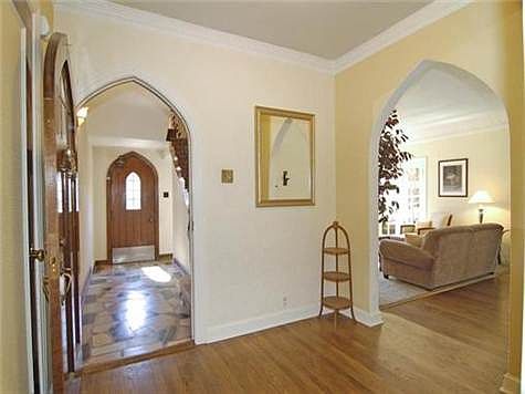 First floor entry with view toward common area entrance & formal