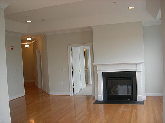 View of hallway to foyer from living room.