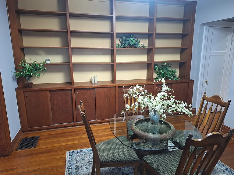 Dining room with shelves and cabinets
