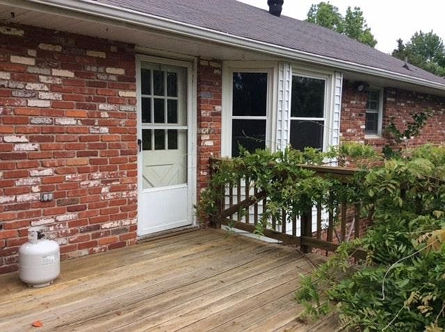 The back deck is high above the yard and has privacy wall.