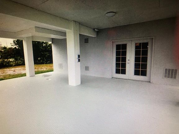 Covered Carport Parking area under home.