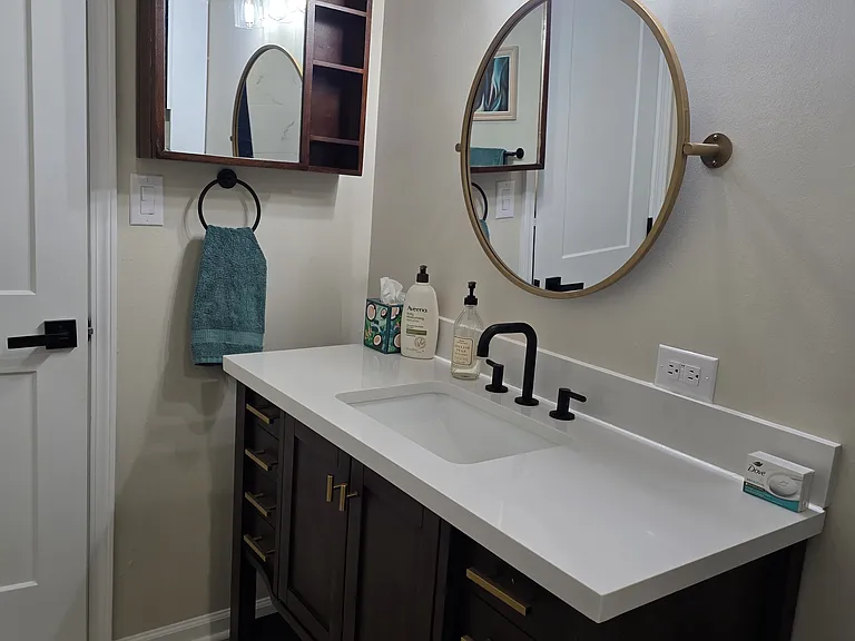 View of vanity, lighting, and additional storage