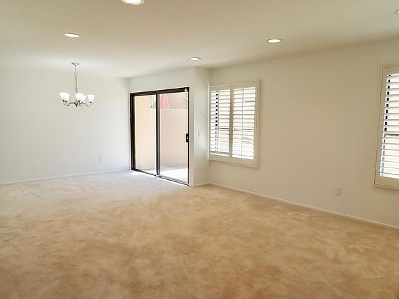 Living Room with sliding door leading to patio and double car garage