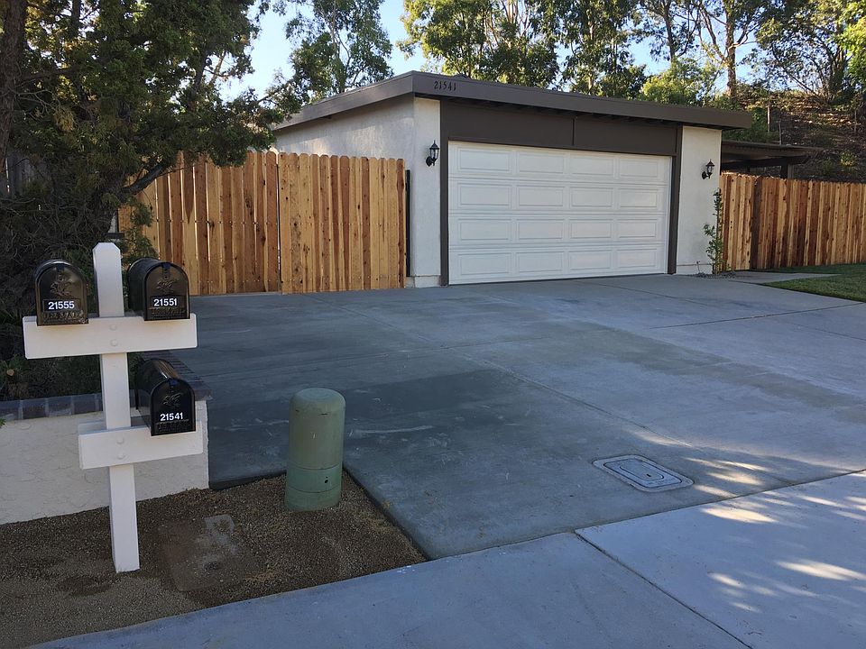 Street View showing garage and side yard parking