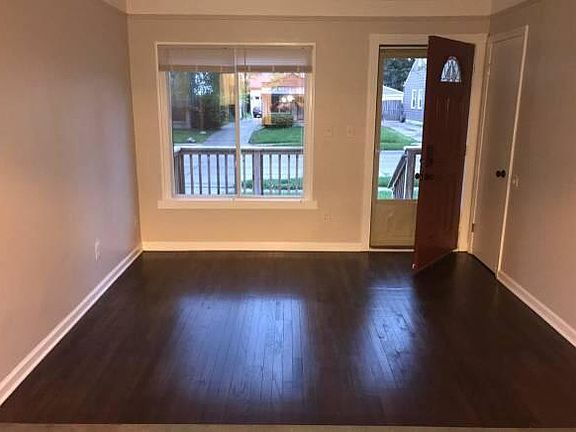 Living room with richly stained hardwood floors