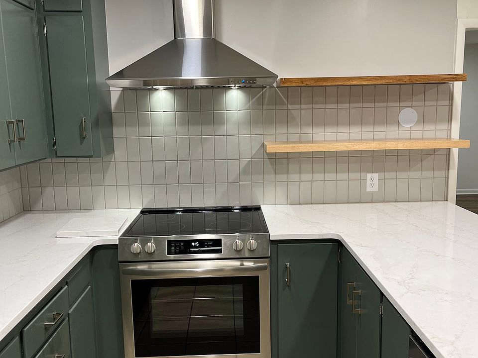 New electric stove, vent hood and quartz countertop
