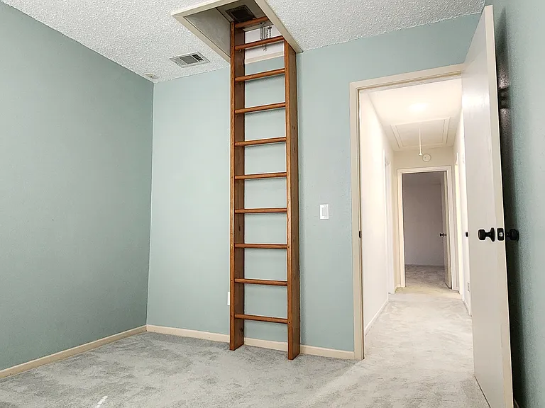 Bedroom 1 with ladder access to hidden nook