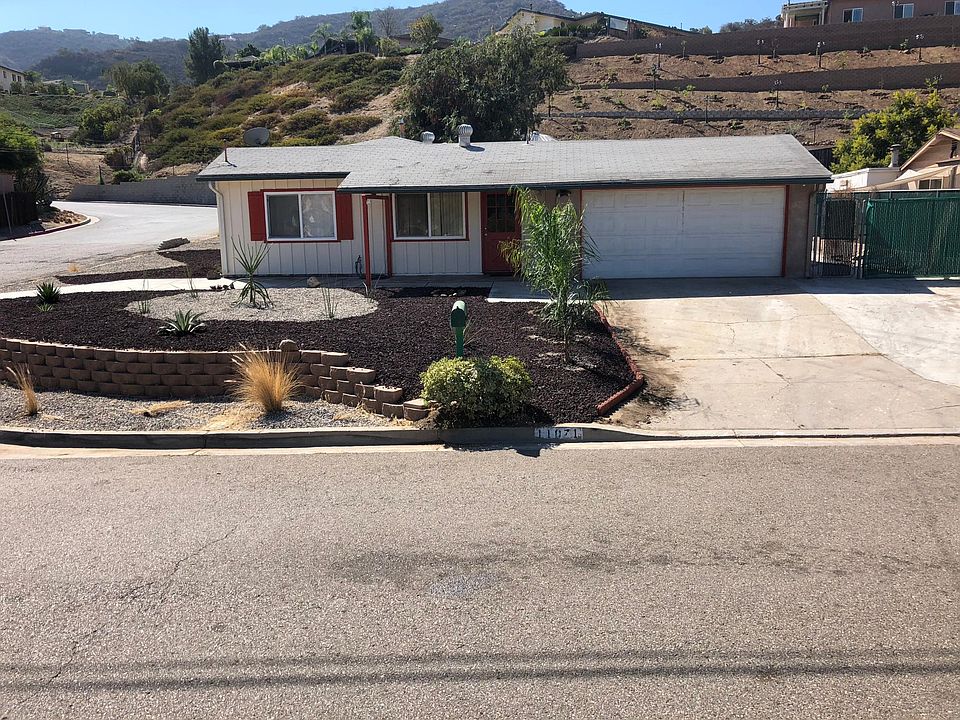Fully fenced corner lot with access on 2 sides. Low maintenance landscaping.