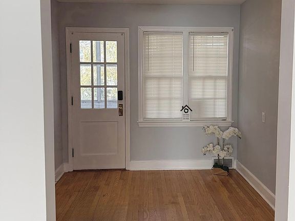 Dining Room, kitchen entrance is to the left. This is the backdoor, with entrance to a private balcony.