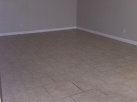 Tile flooring in all common areas. A/C wall unit. Large Liv