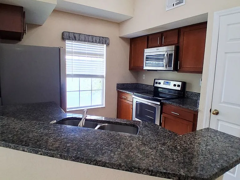 9020 Lake Chase Island Way — Photo 17