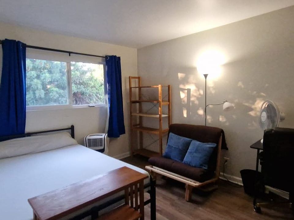 Bedroom with full bed plus frame futon that can be pulled out into a bed. Desk, chair, lamp, fan, AC and bookshelf provided. If you need bedding, we have some to lend!