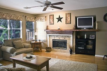 Den has gas logs, gorgeous hardwood flooring.