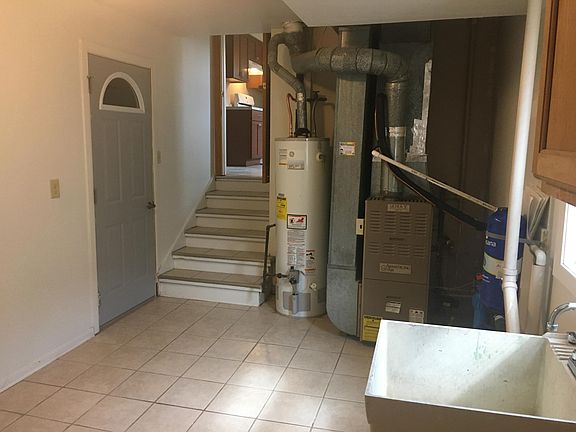 Laundry room with utilities and extra space for office use. ( for example )