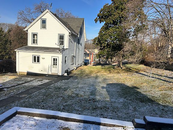 Large yard, parking pad and garage