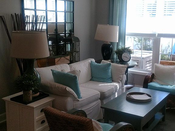 Living room is open to the kitchen and dining with 5 large floor to ceiling windows.