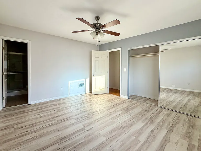 Primary bedroom with attached bathroom