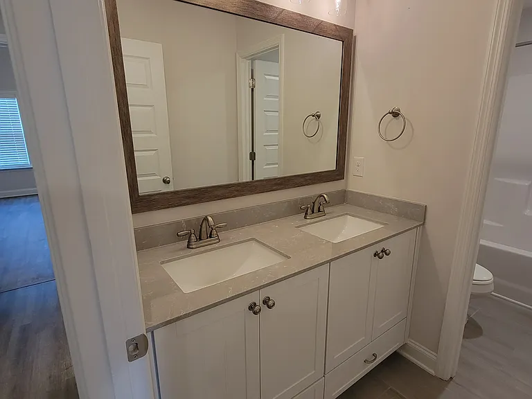 Upstairs bathroom with double sink vanity