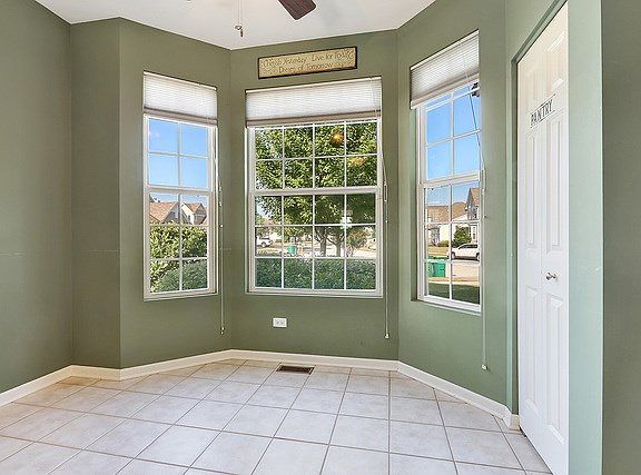 A nice breakfast nook is right on the other side of the 1/2 wall in the kitchen.  Fits a table for 4