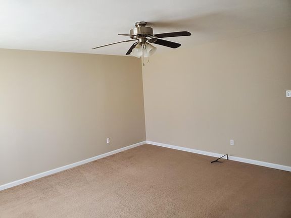 Living room with Ceiling fan.