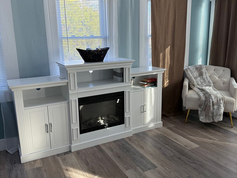 Electric fireplace and storage inside bedroom #1