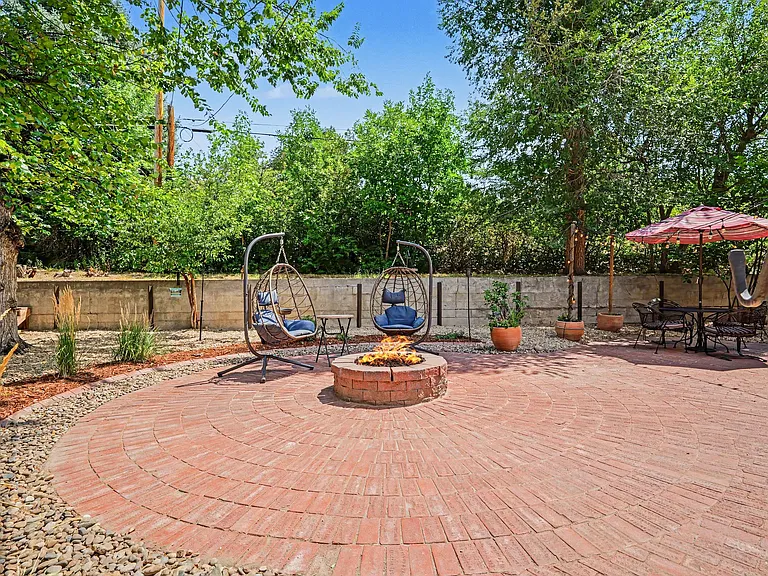 Amazing backyard patio with gas firepit and buffet area for potlucks and entertaining