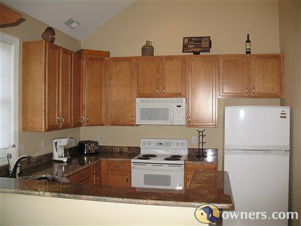 Open Kitchen with Maple Cabinets & Exotic Granite