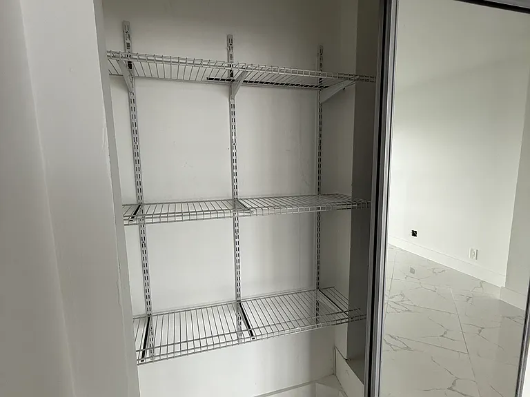 Second large closet in MASTER BEDROOM with full wall mirror doors