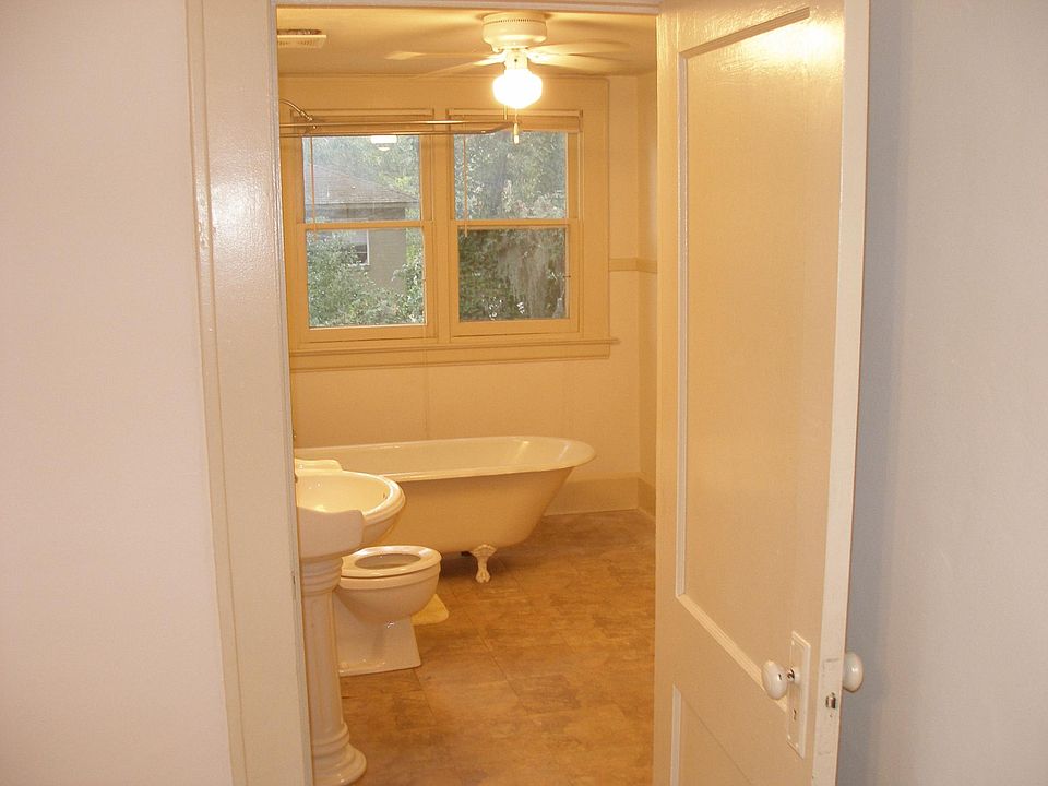Picture of bathroom with clawfoot tub. Linen closet